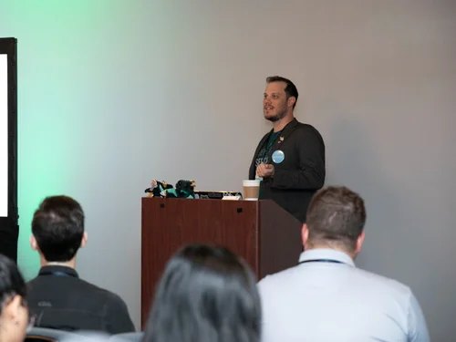 Jacob speaking at a Salesforce conference session